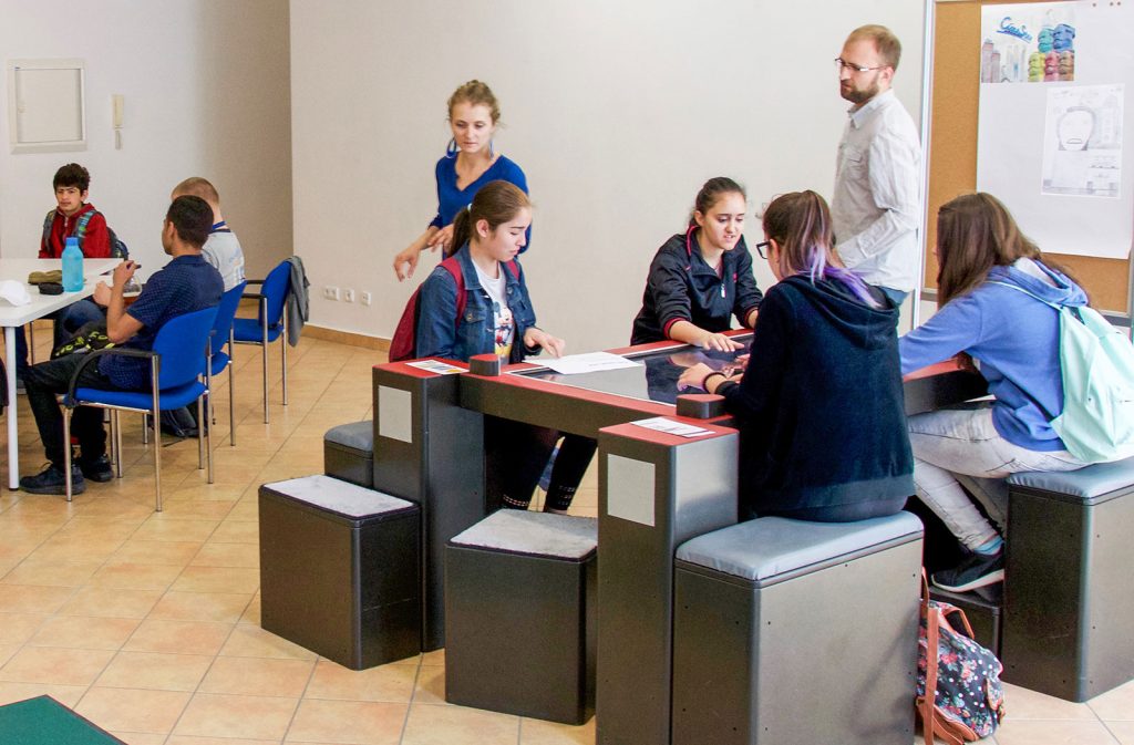 Students working at a multitouch table