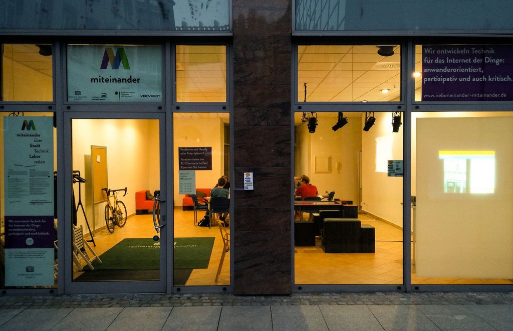 The Miteinander Living Lab shown from outside in the evening.