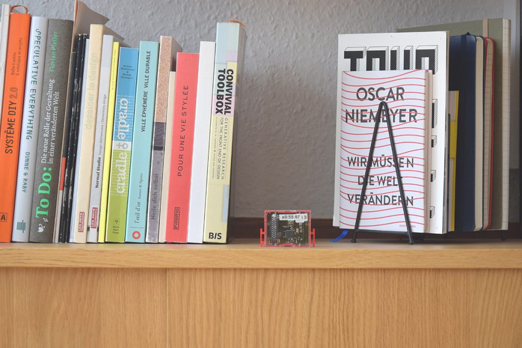 A Sensor Tag in the bookshelf, facing the room