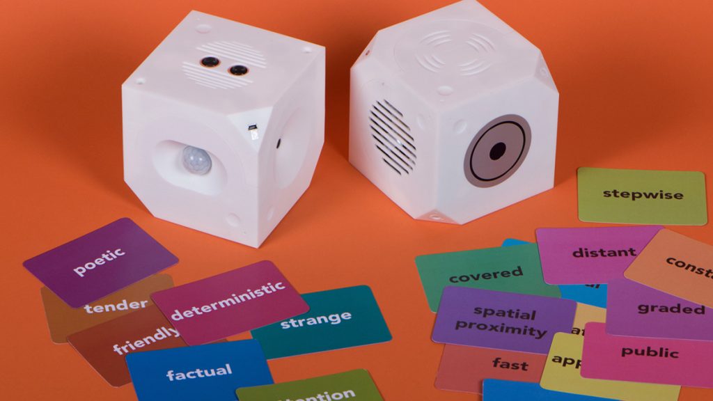 The Loaded Dice Toolkit, consisting of two interactive cubes, with a sensor cube that can measure six different qualities and an actuator cube that has six different outputs.